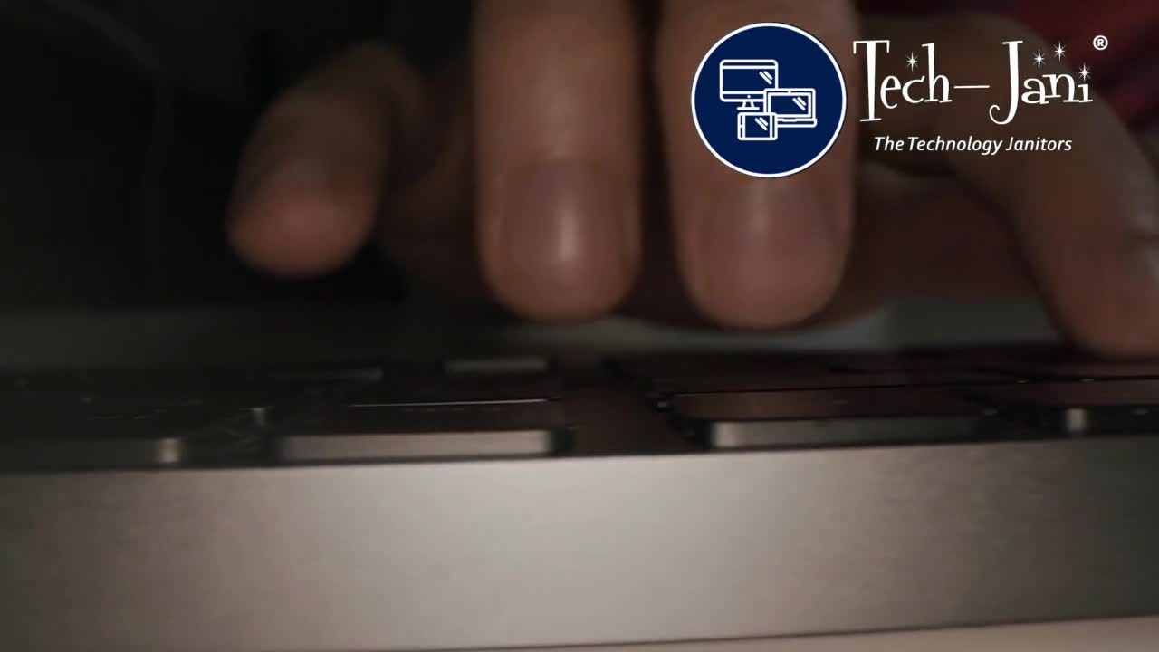 Close-up from the Tech-Jani video of a person using a laptop keyboard